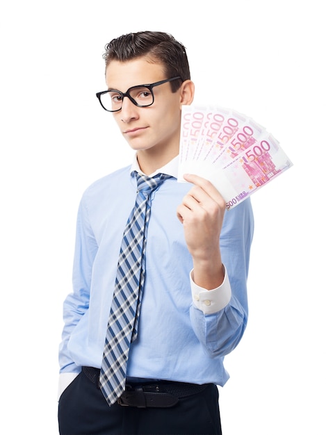 Tevreden werknemer met zijn hand vol bankbiljetten
