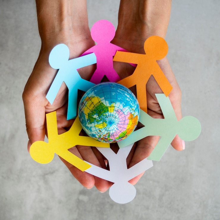 Gratis Foto top view origami keten mensen met een aardbol