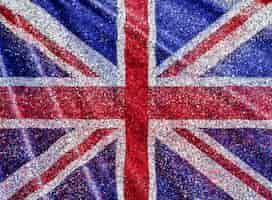 Gratis foto union jack flag-achtergrond met glittereffect