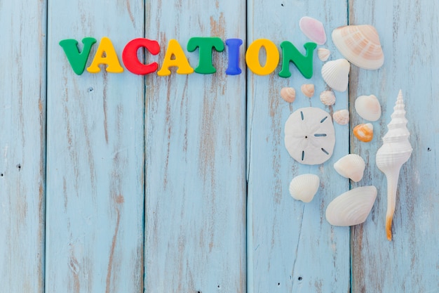 Gratis foto 'vacation' opschrift en schelpen