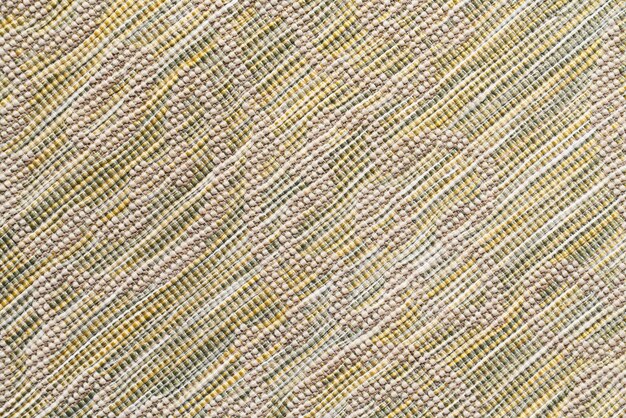 Veelkleurige geweven vloerkleedtextuur met neutraal schaduwpatroon