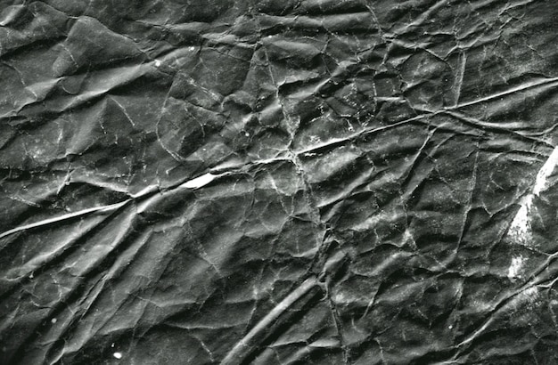 Gratis foto verfrommeld zwart papier textuur