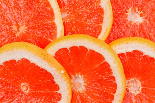 Gratis foto verse grapefruit segmenten. detailopname. horizontaal.