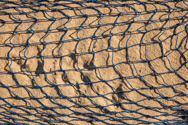 Visnet op zand