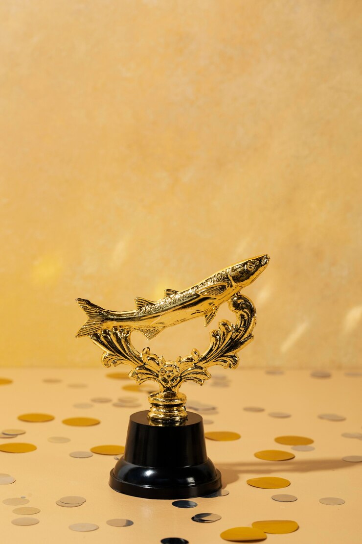Gratis Foto winnaarconcept met gouden vis