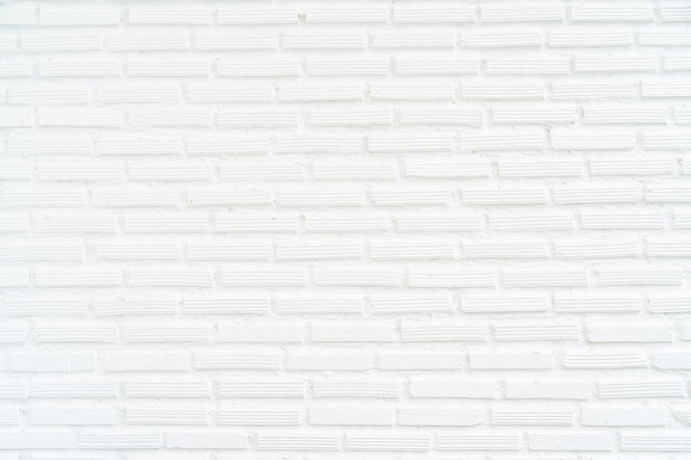 Witte bakstenen muur belast en achtergrond