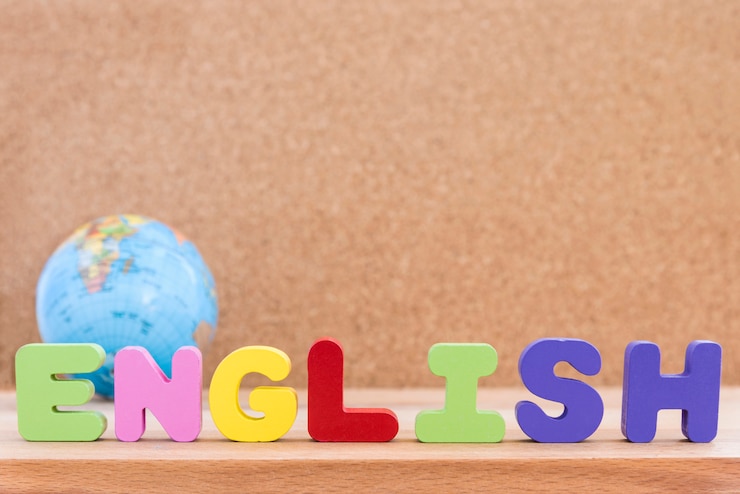 Woord engels met wereldbol over houten achtergrond