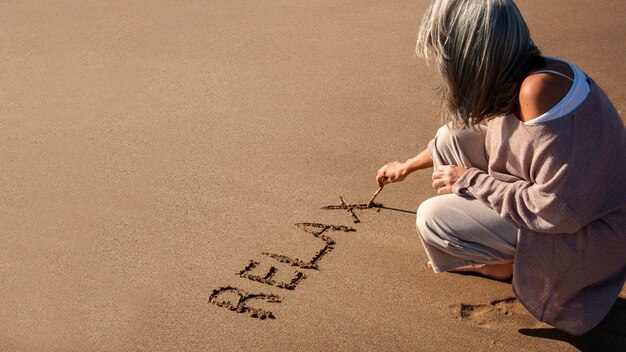 Woorden in het zand over de zomer