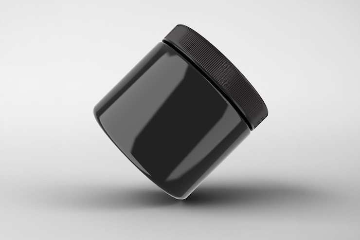 Gratis Foto zwarte cosmetische pot met een geïsoleerd deksel op een witte achtergrond