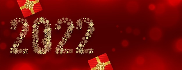2022 nieuwjaar rode banner gemaakt met gouden sneeuwvlokken met geschenkdoosex