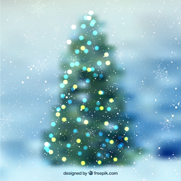 Gratis vector bokeh achtergrond van defocused kerstboom