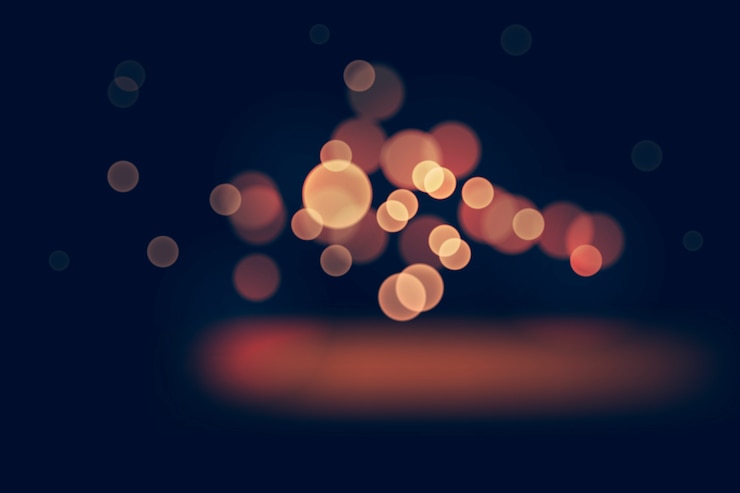 Gratis Vector bokeh-licht-effect op donkere achtergrond