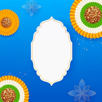 Bovenaanzicht van tricolor papier glitter badge of bloem versierd op blauwe mandala patroon achtergrond en leeg vintage frame.