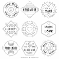 Gratis vector collectie handgemaakte vintage emblemen