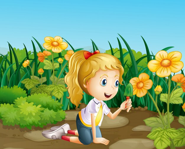 Een meisje in de tuin met een schop