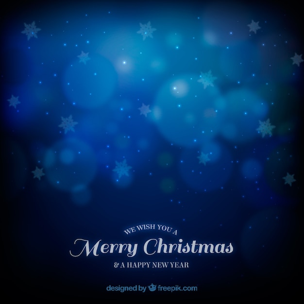 Gratis vector elegante blauwe wazige kerstmis achtergrond