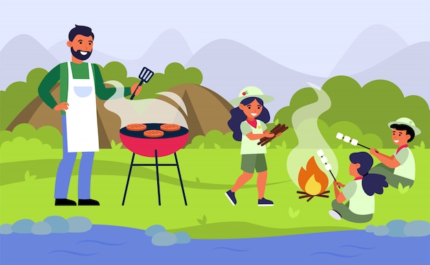 Familie die barbecuepicknick heeft bij rivierbank