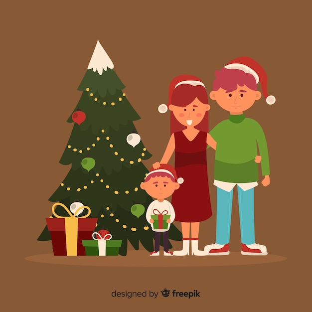 Gratis vector familie naast de kerstboom