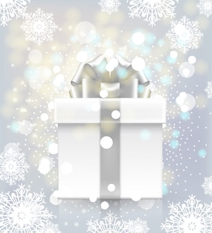 Geschenkdoos met een strik op een achtergrond van sneeuwvlokken en lichten flikkeren.