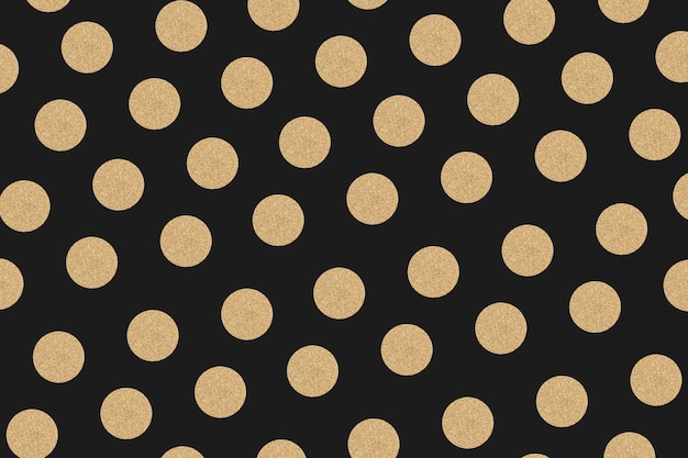 Gouden en zwarte polka dot glittery patroon achtergrond