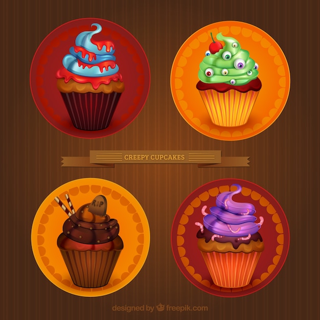 Gratis vector griezelig halloween cupcakes