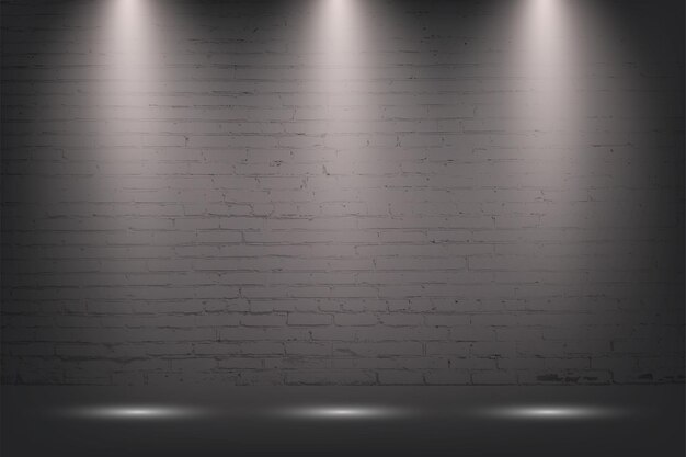 Grijze bakstenen muur met spotlight stenen achtergrond Licht van drie lampen op betontextuur