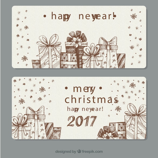 Gratis vector hand-drawn banners met decoratieve geschenken voor het nieuwe jaar
