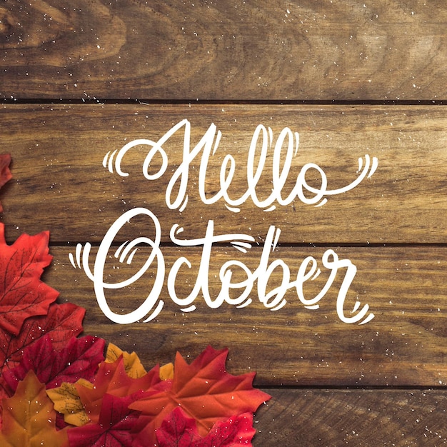 Gratis vector hand getekend hallo oktober belettering met foto