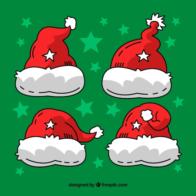 Gratis vector hand getrokken santa's hoed-collectie