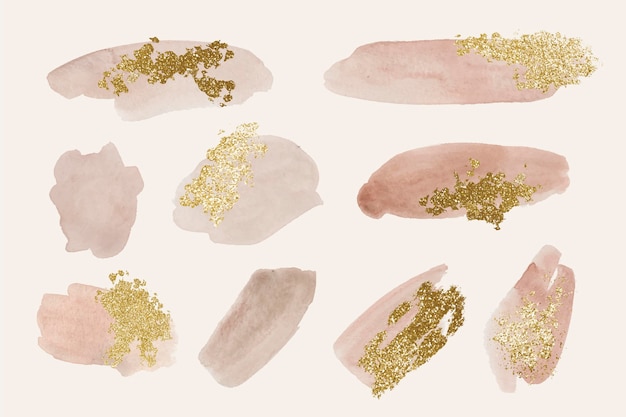 Gratis vector handgeschilderde aquarel penseelstreken met goud en glitter