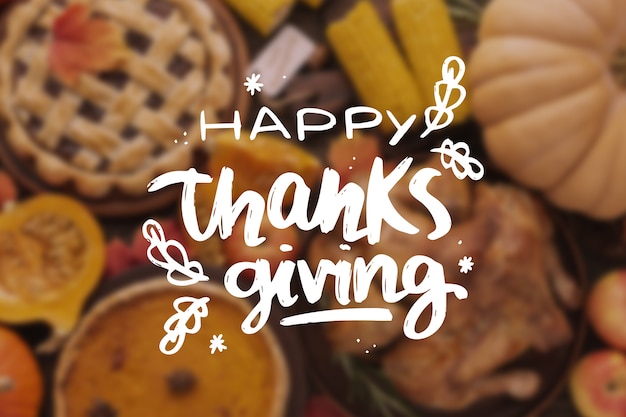 Gratis vector happy thanksgiving belettering op onscherpe achtergrond