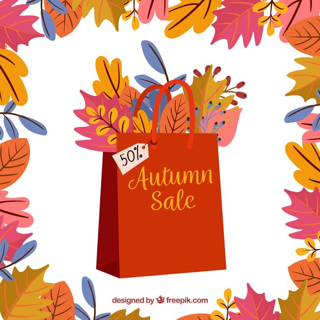 Gratis vector herfstverkoop met bladeren en boodschappentassen