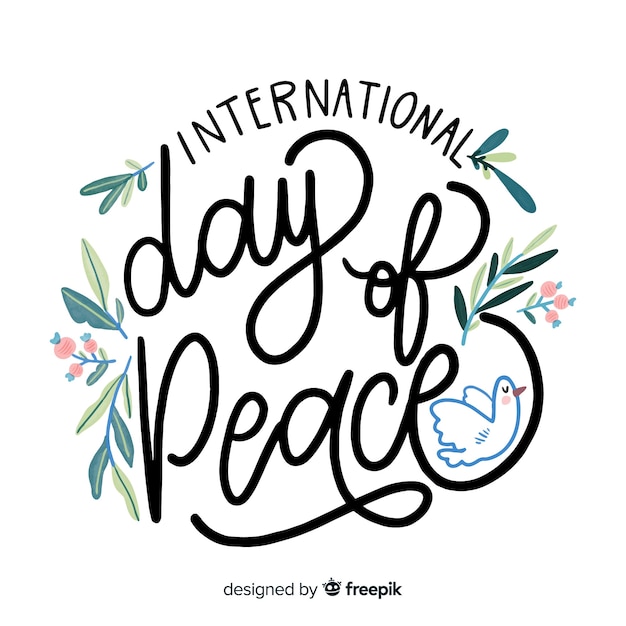 Gratis vector internationale dag van vredessamenstelling hand getrokken belettering