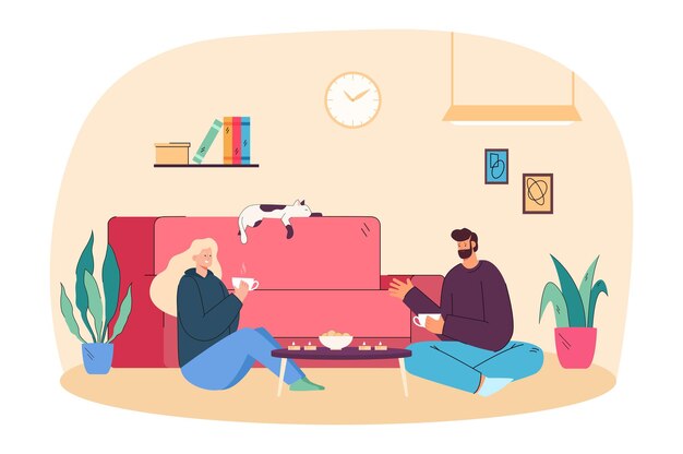 Jong koppel eten koekjes met thee in comfortabele woonkamer. Romantisch gesprek van volwassen vrouw en man zittend op de vloer in de buurt van home sofa en genieten van voedsel platte vectorillustratie. Hygge, liefdesconcept