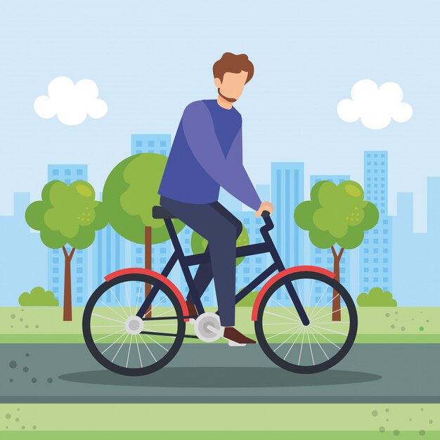 Jonge man in fiets in het park