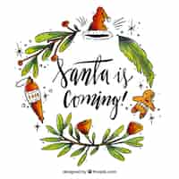 Gratis vector kerst belettering met florale decoratie