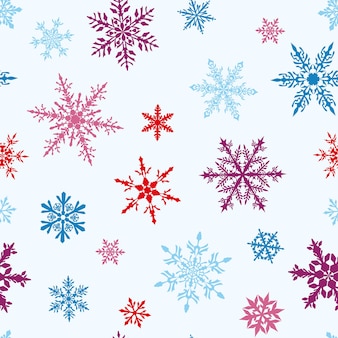 Kerst naadloos patroon van complexe grote en kleine veelkleurige sneeuwvlokken op witte achtergrond