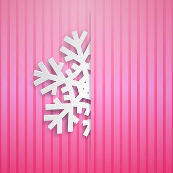 Kerstillustratie met een witte grote sneeuwvlok die uit de snede steekt op een gestreepte achtergrond in roze kleuren