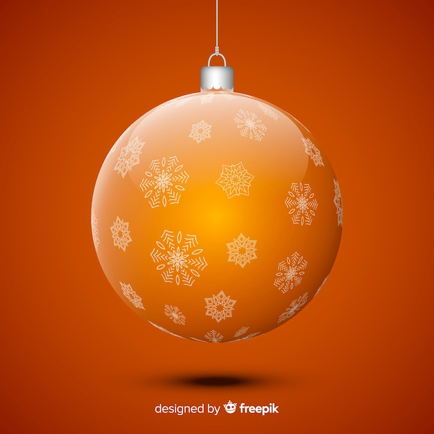 Gratis vector kristallen kerstmisbal op gele achtergrond