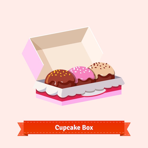 Gratis vector lekker uitziende cupcakes in de kartonnen doos