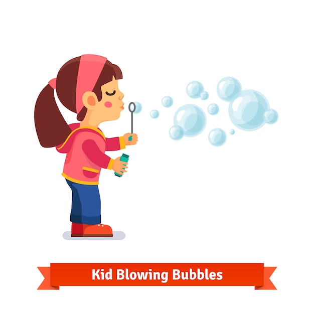 Leuk klein meisje blaast zeepbellen door de wand