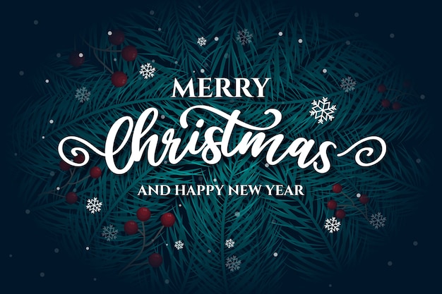 Gratis vector merry christmas belettering met pijnboombladeren