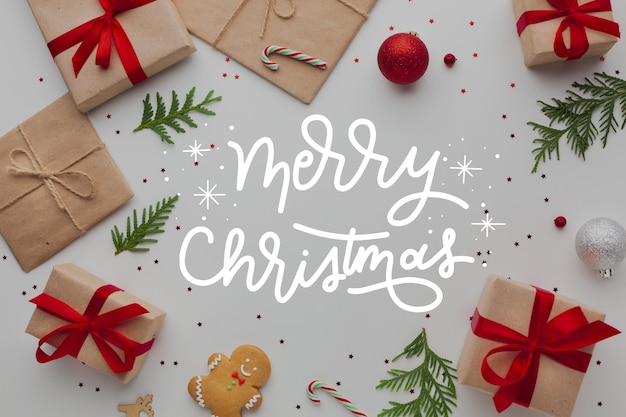 Merry Christmas belettering op foto met presenteert