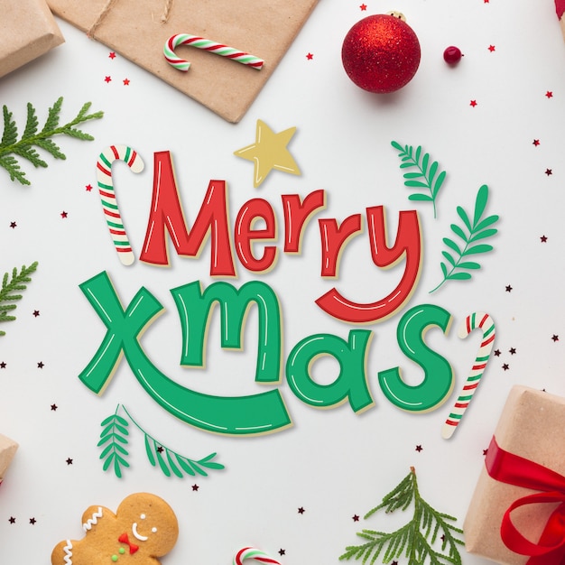 Gratis vector merry christmas belettering op kerstmis foto