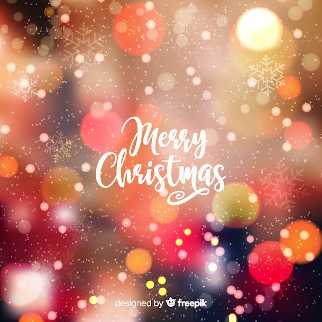 Gratis vector merry christmas bokeh achtergrond