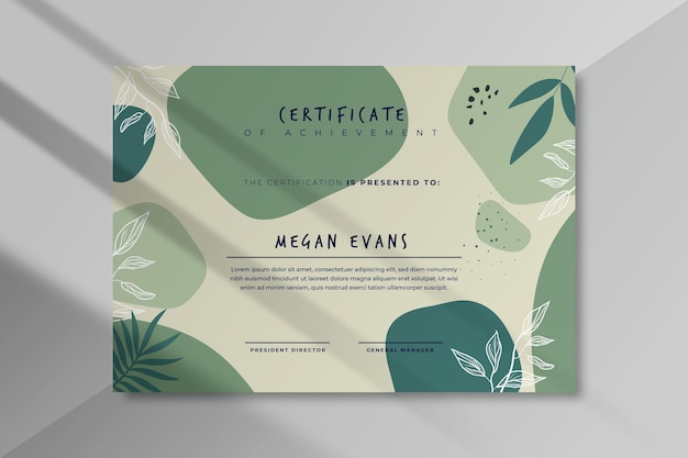 Gratis vector moderne certificaatsjabloon met bladeren