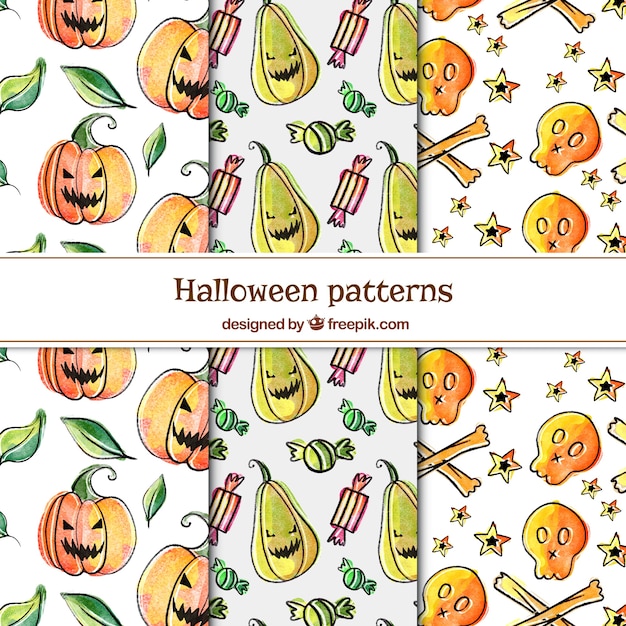 Gratis vector pak met hand getekende halloween patronen