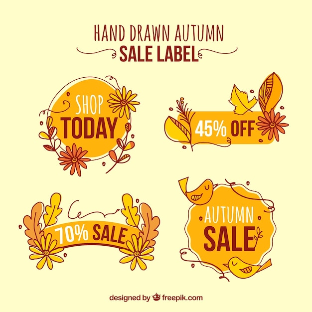 Gratis vector pak van handgetekende herfstverkoopstickers