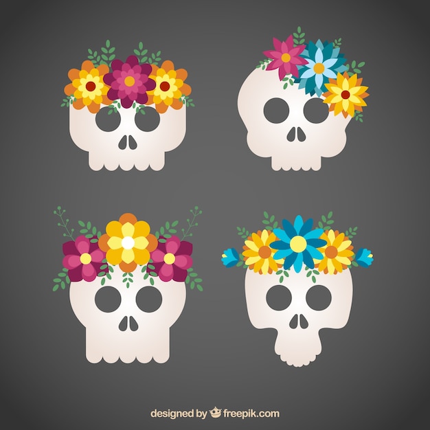 Gratis vector schedels met mooie gekleurde bloemen