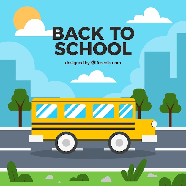 Gratis vector schoolbus op de weg met plat ontwerp